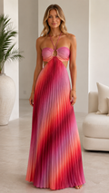 Front view of pink ombre pleated halter maxi dress with front ring detail and side cutouts